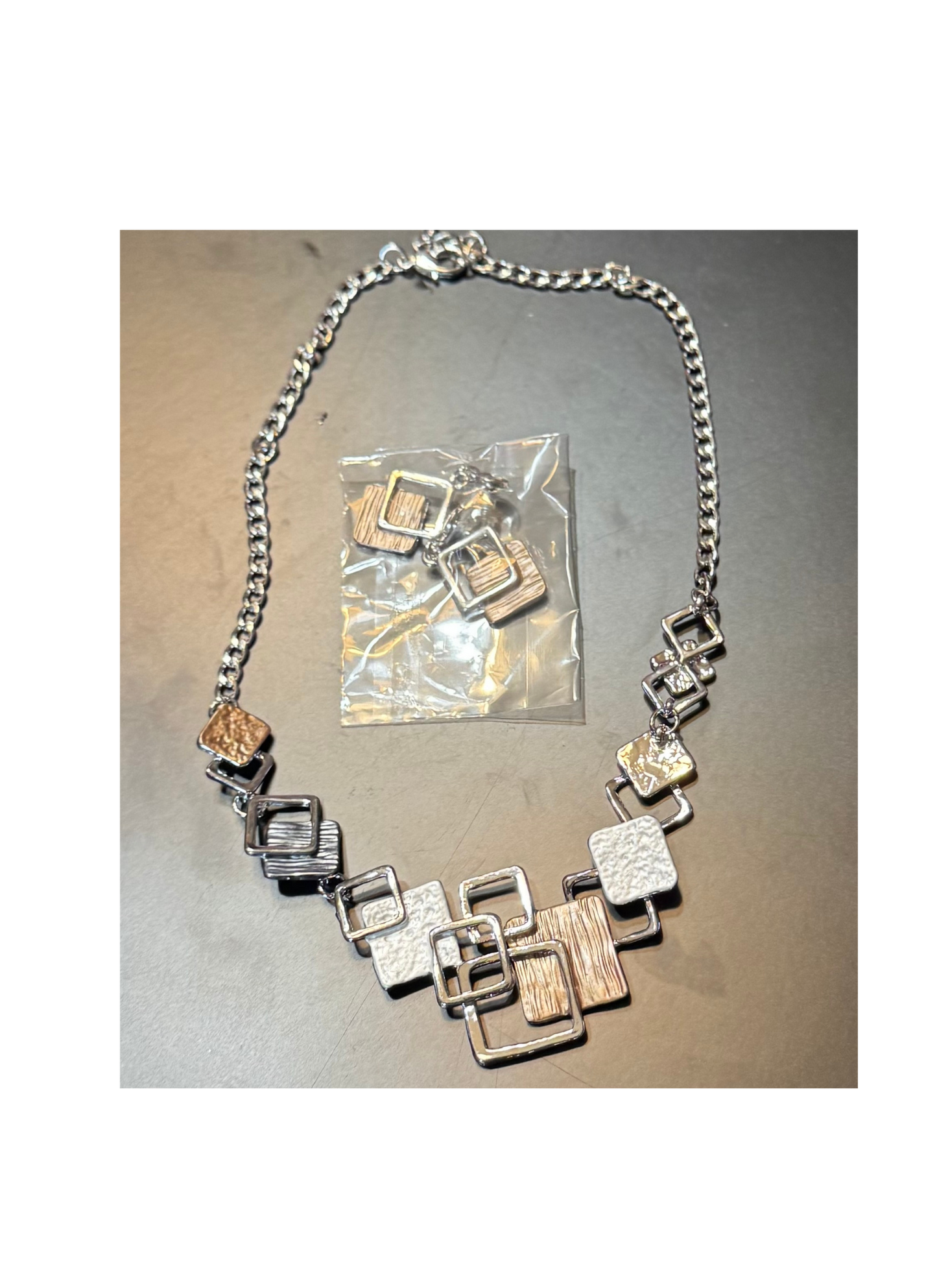 Gold and silver earring and necklace set